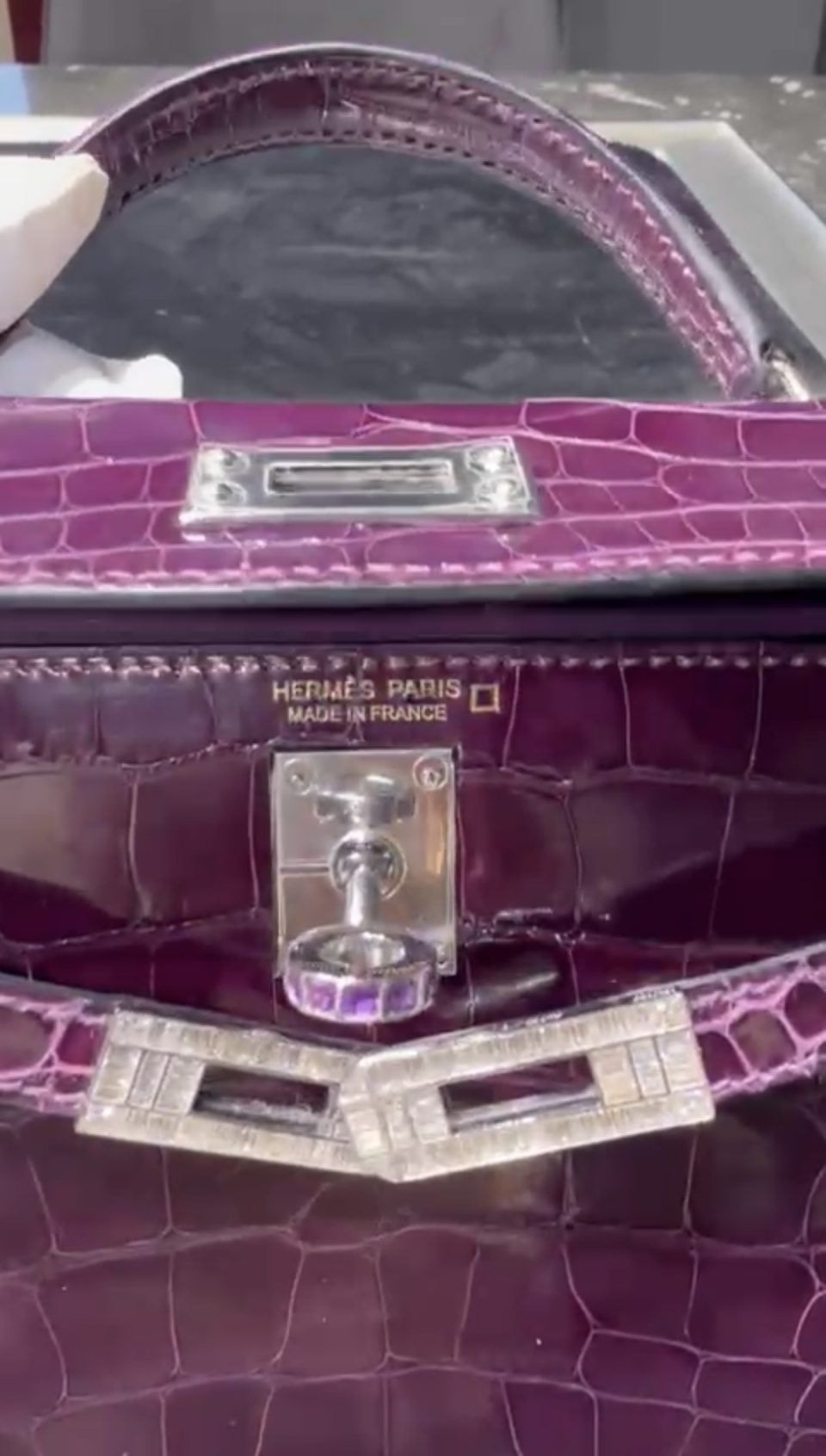AMETHYST
Fashion is Art.
Some objects are worn.
Some are collected.
Some become part of history.
AMETHYST exists beyond the rhythm of seasonal fashion. It was created as a permanent object of desire—where the discipline of haute maroquinerie meets the precision of high jewellery.
The iconic Hermès Kelly 20 Sellier Mini becomes a canvas for contemporary craftsmanship, transformed through bespoke 18K white gold hardware, invisible engineering and hand-set baguette diamonds. At its heart, a natural amethyst serves as the soul of the composition—quiet, powerful and unmistakable.
Every line was considered.
Every surface refined.
Every detail created to be remembered.
This is not personalization.
This is artistic authorship.
Not made for everyone.
Made for the few who understand that true luxury is defined not by price, but by rarity, provenance and meaning.
A collectible object.
A wearable sculpture.
An archive piece for the future.
⸻
The Diamond Hermès Kelly 20 Sellier Mini Shiny Alligator
Bespoke 18K White Gold Hardware
Baguette Diamonds & Natural Amethyst
Created by ARTBURO
Designed by Alisa Kovtunova
2025